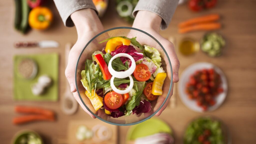 A woman holding a bowl from a right restaurant for your dietary needs