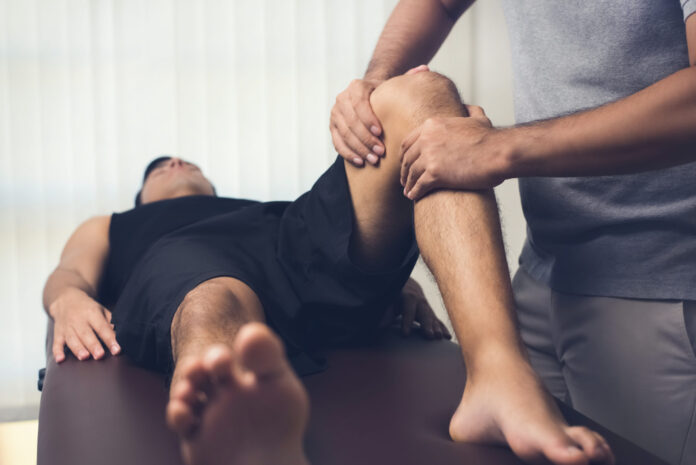 Athlete suffering from sports injuries