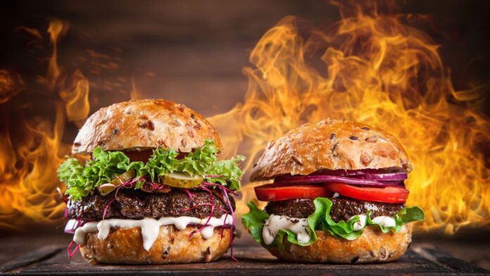 Two might burgers participating in a delicious burger battle